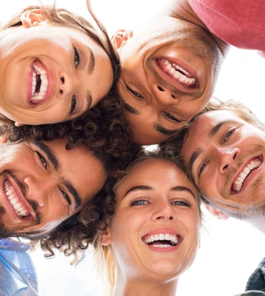 Smiling person showcasing white teeth after laser whitening treatment Watford